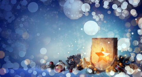 Image of Composition with wooden Christmas lantern on snow, space for text. Magical atmosphere 