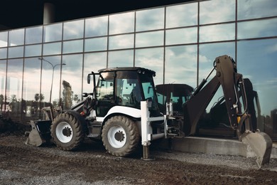 Photo of Modern skid loader on construction site outdoors