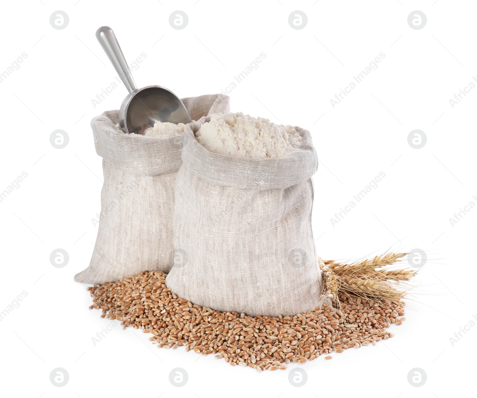 Photo of Sack with flour, wheat grains and spikes on white background