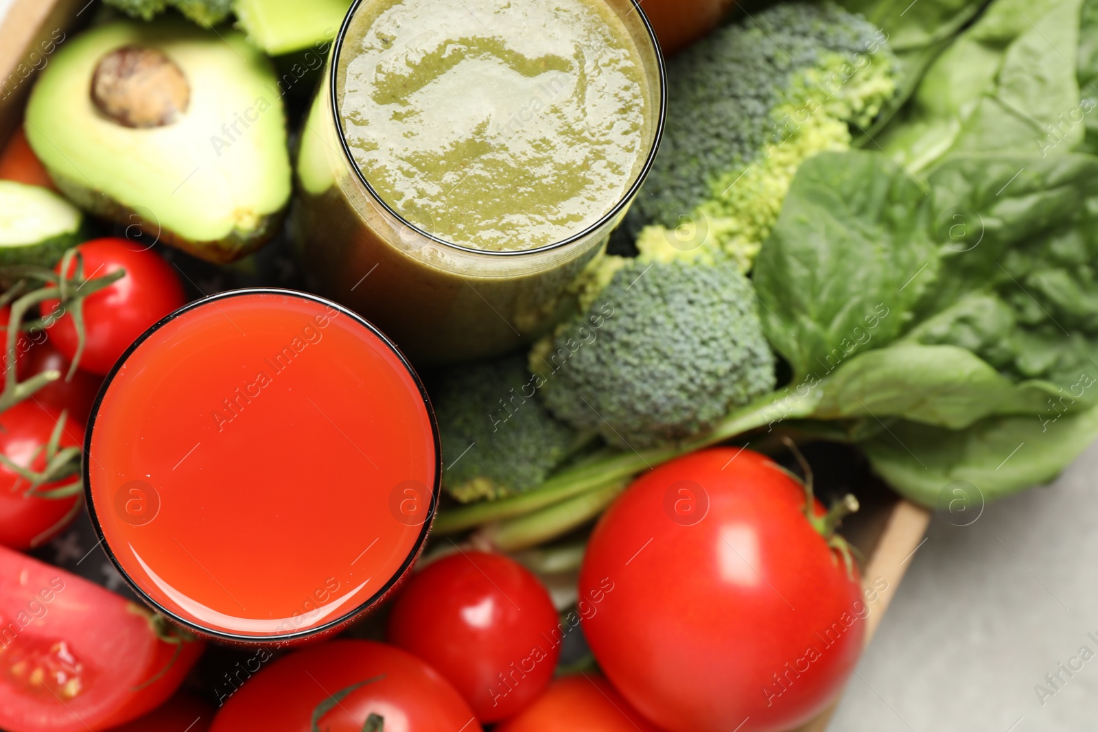 Photo of Delicious vegetable juices and fresh ingredients on table, top view