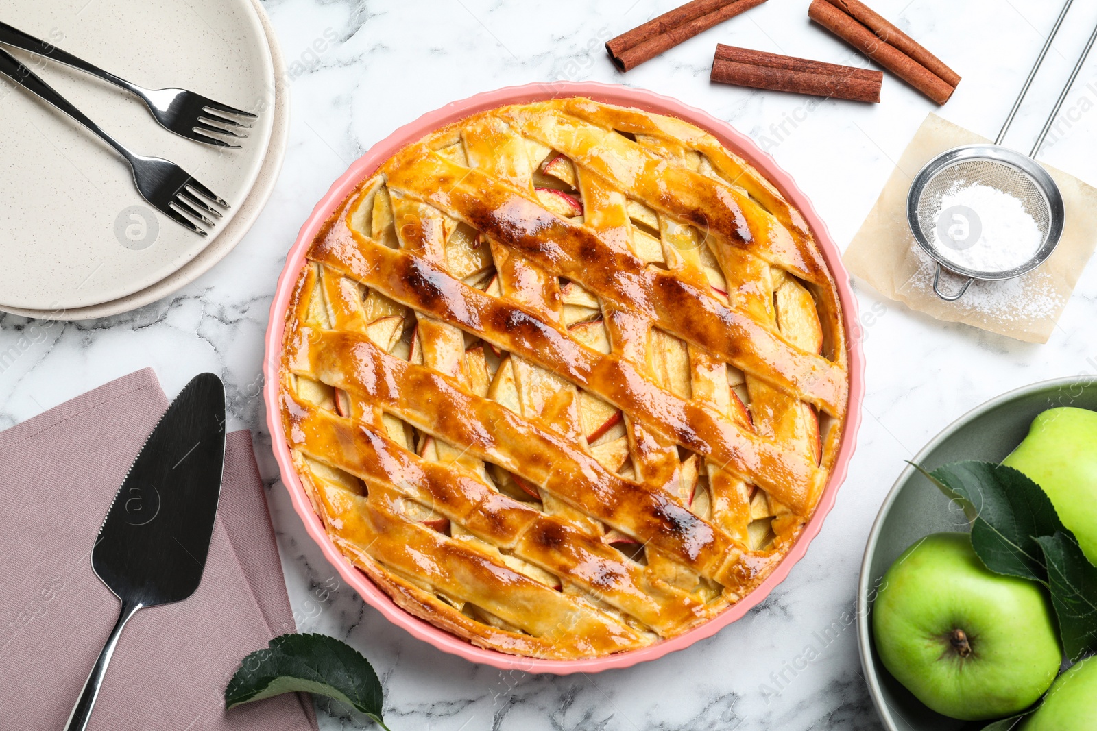 Photo of Flat lay composition with fresh traditional apple pie on white marble table