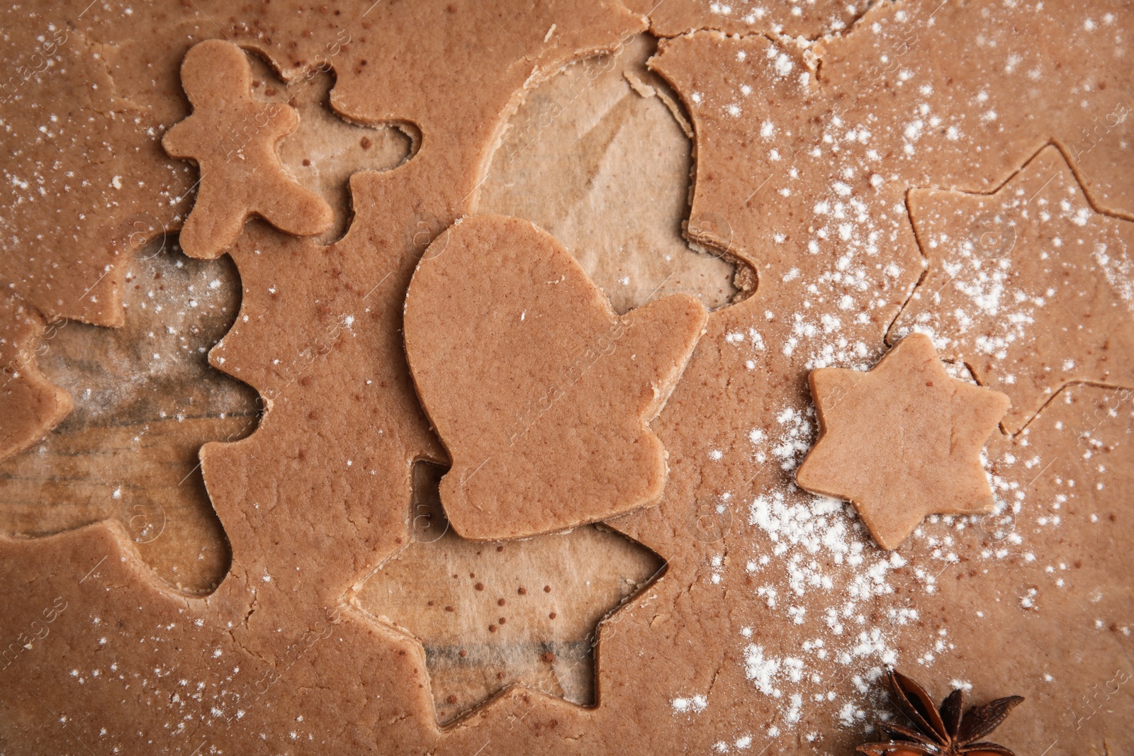 Photo of Making Christmas cookies. Raw dough and anise on table, top view