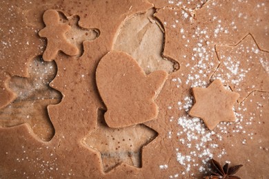 Photo of Making Christmas cookies. Raw dough and anise on table, top view