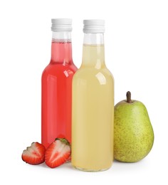 Photo of Delicious kombucha in glass bottles, pear and strawberry isolated on white