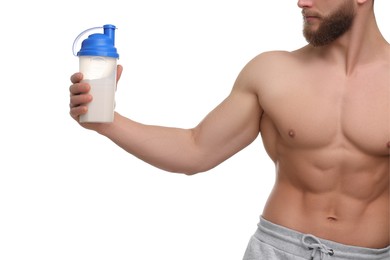 Young man with muscular body holding shaker of protein on white background, closeup