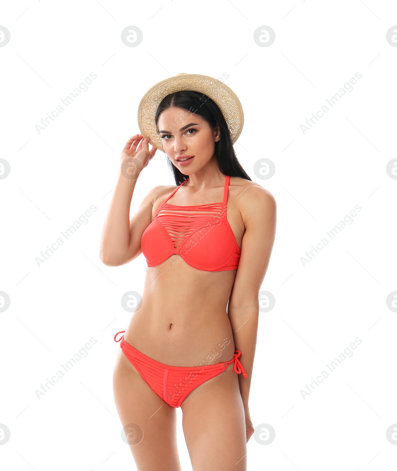 Photo of Beautiful young woman in stylish bikini with hat on white background