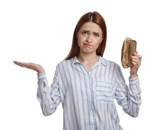 Upset woman with empty wallet on white background