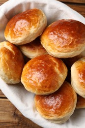 Tasty scones prepared on soda water on wooden table, top view