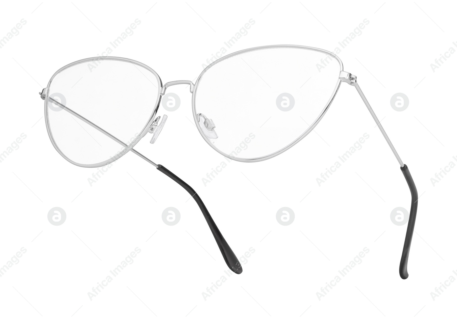 Photo of Stylish glasses with metal frame isolated on white