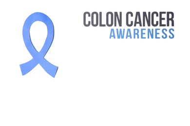Photo of Blue ribbon and words COLON CANCER AWARENESS on white background, top view