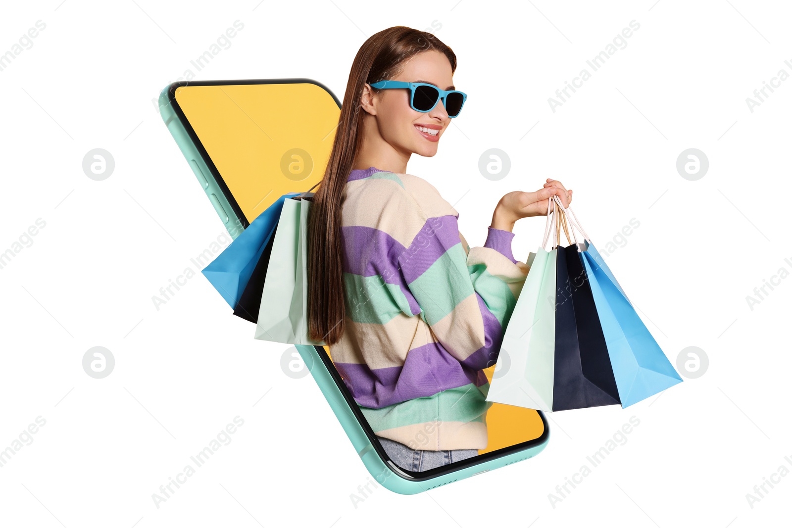 Image of Online shopping. Happy woman with paper bags looking out from smartphone on white background