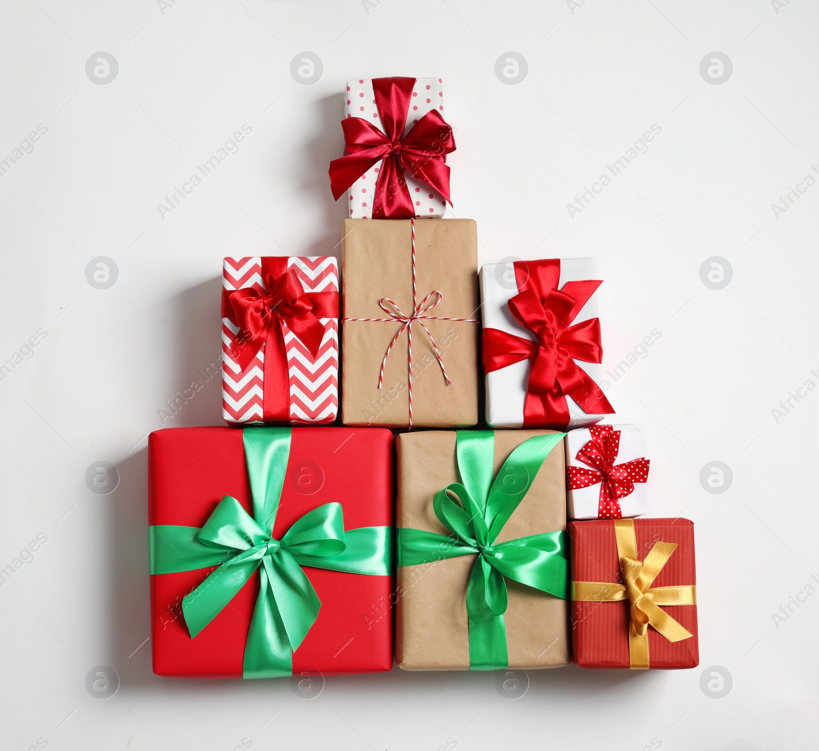 Photo of Beautifully wrapped gift boxes on white background