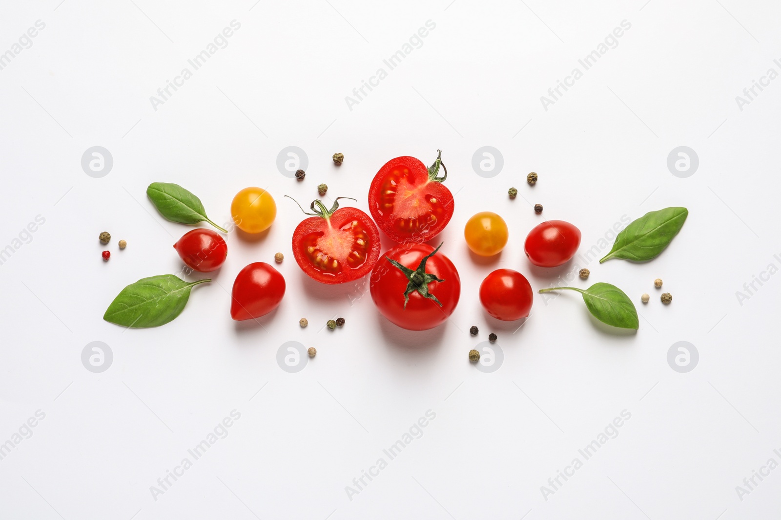 Photo of Composition with ripe cherry tomatoes and basil leaves on white background, top view