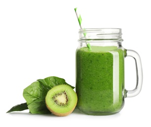 Photo of Green juice in mason jar and fresh ingredients on white background