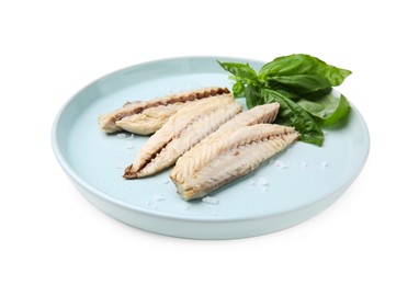 Photo of Plate with canned mackerel fillets and basil isolated on white