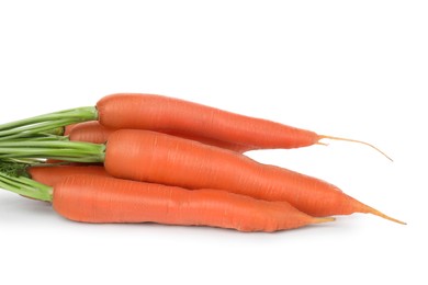 Many tasty ripe carrots on white background