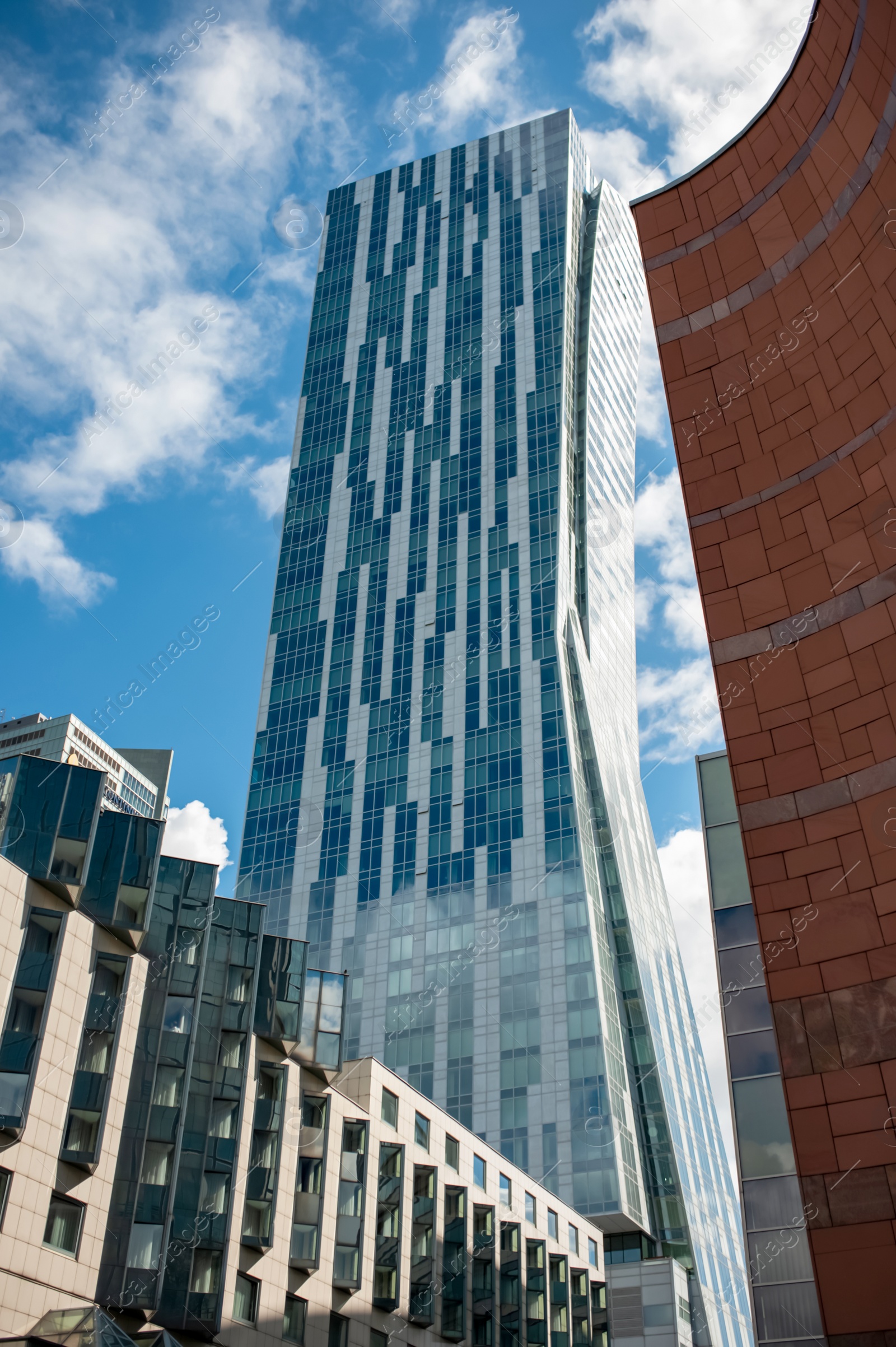 Photo of Beautiful building with many windows under cloudy sky