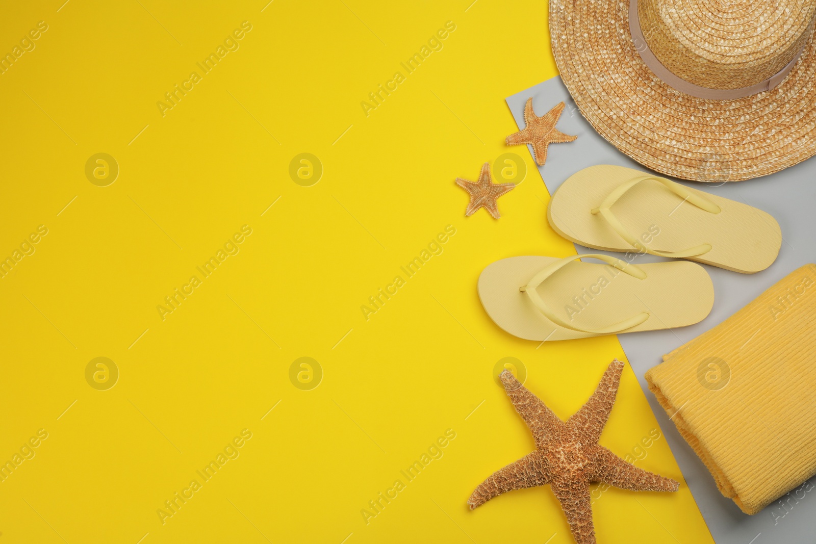 Photo of Flat lay composition with beach objects on color background, space for text