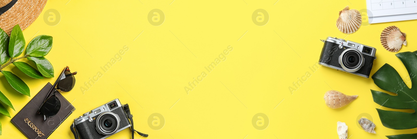 Image of Flat lay composition with vacation accessories on yellow background, space for text. Banner design