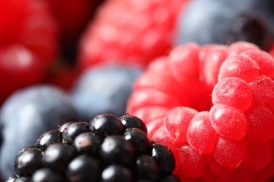 Different fresh ripe berries as background, macro view