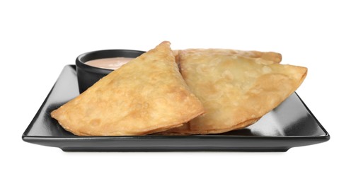 Photo of Fresh delicious crispy samosas with sauce on white background