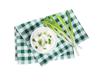 Fresh sour cream with onion and fabric on white background, top view