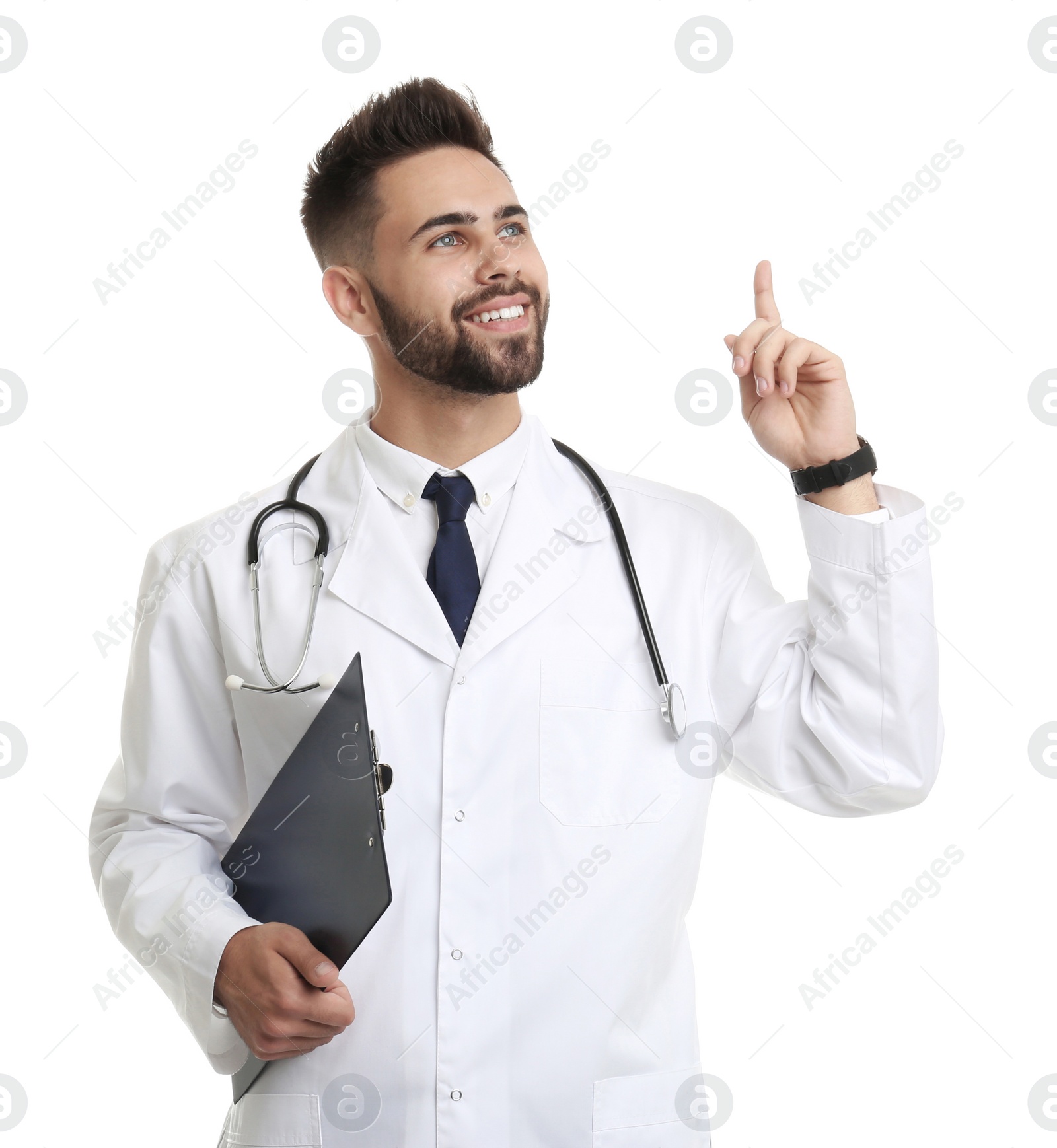 Photo of Young male doctor in uniform with clipboard isolated on white