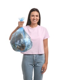 Photo of Woman holding full garbage bag on white background