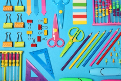 Photo of Flat lay composition with different school stationery on color background