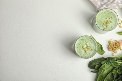 Photo of Flat lay composition with green buckwheat smoothie on white table, space for text