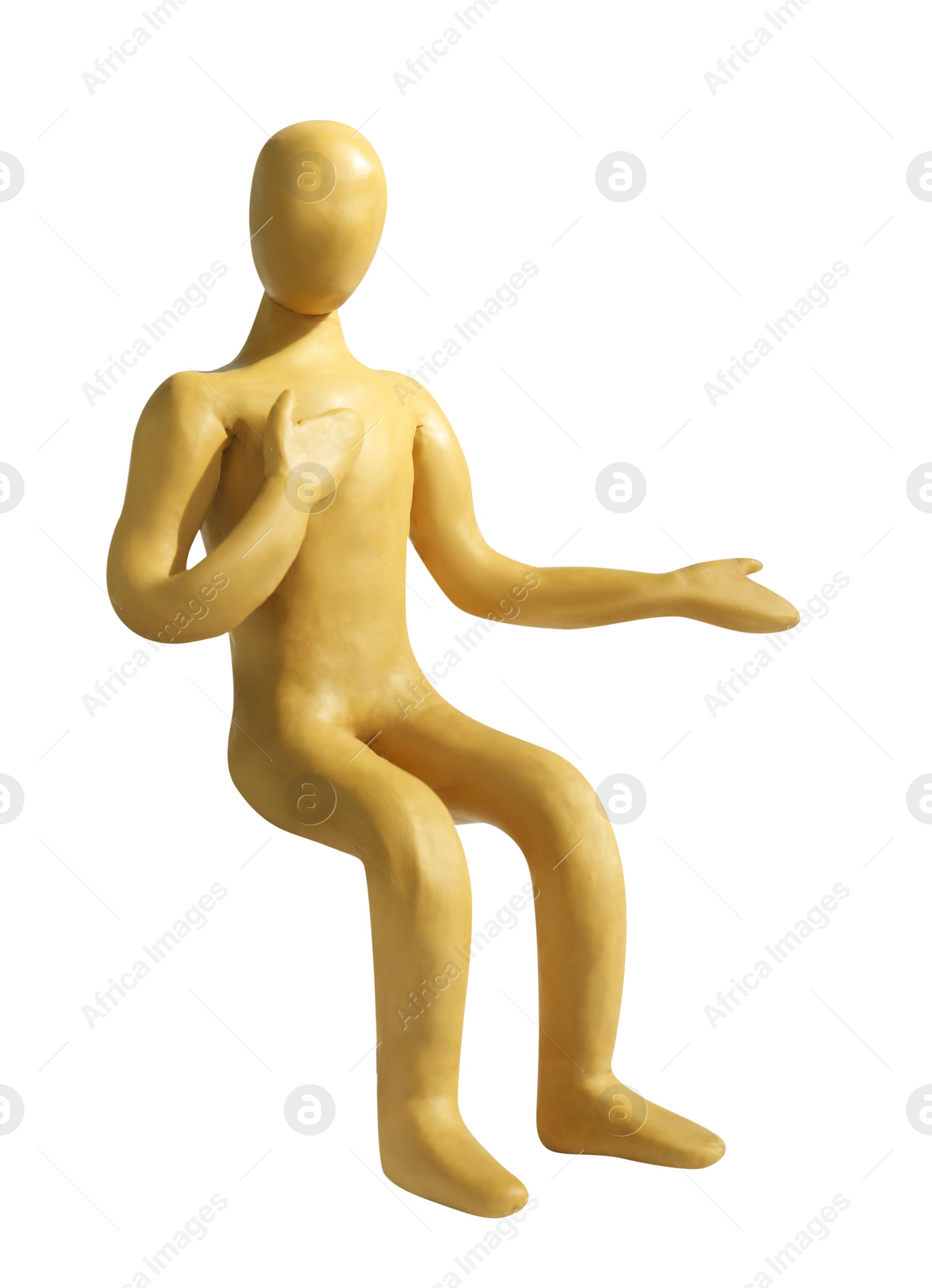 Photo of Yellow plasticine human figure isolated on white