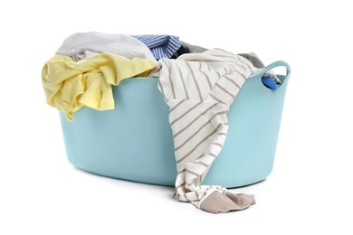 Photo of Plastic laundry basket full of clothes isolated on white