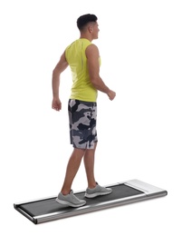 Photo of Sporty man using walking treadmill on white background
