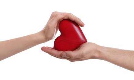 Photo of Man and woman holding decorative heart on white background, closeup