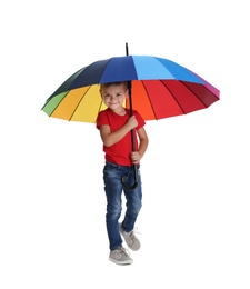 Little boy with rainbow umbrella on white background