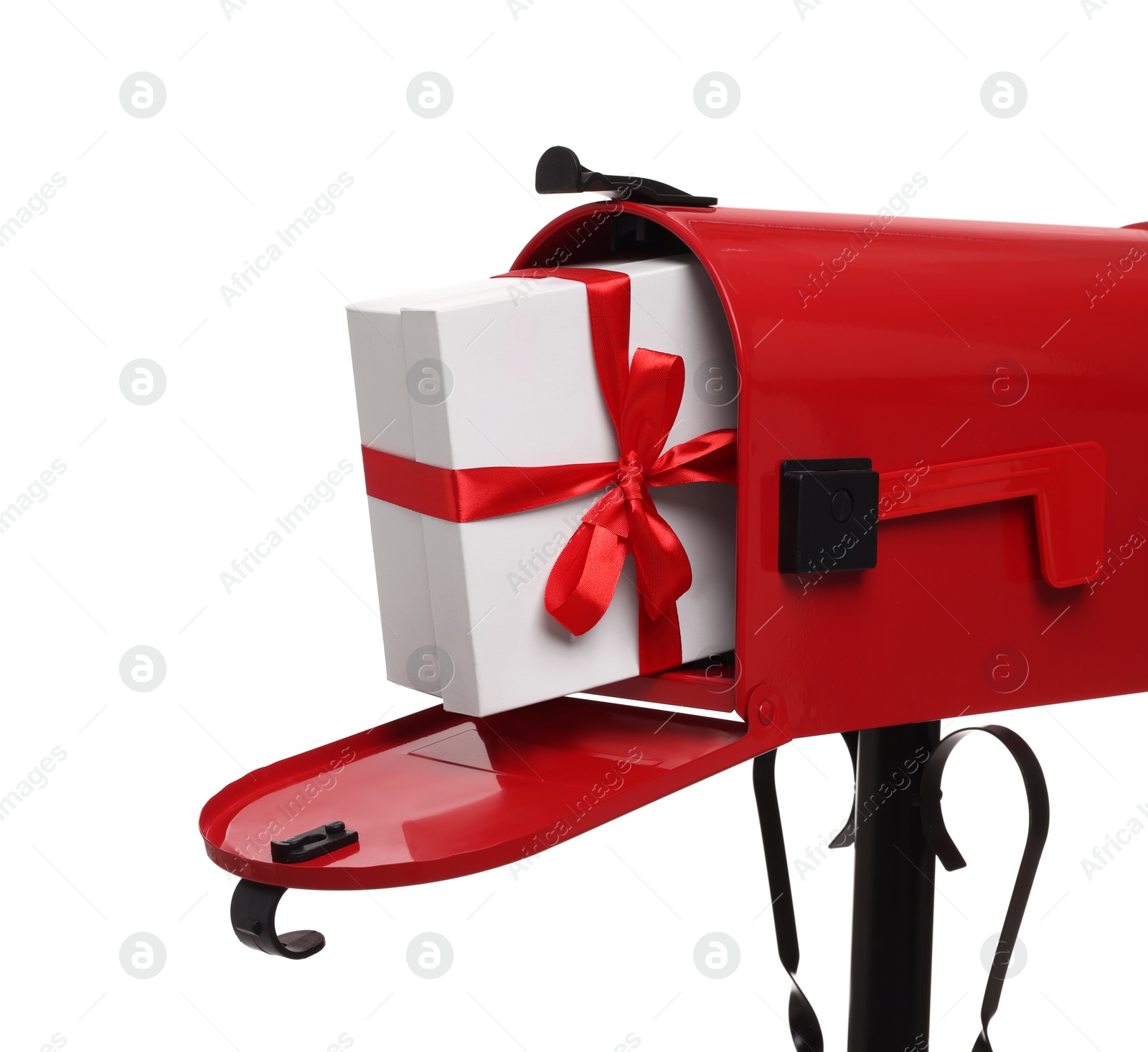 Photo of Red mailbox with Christmas gift isolated on white. Sending present by mail