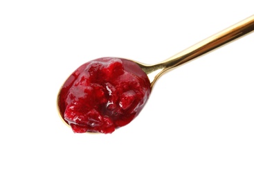 Spoon with cranberry sauce on white background, top view