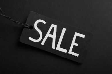 Sale Tag on color background, top view. Black Friday