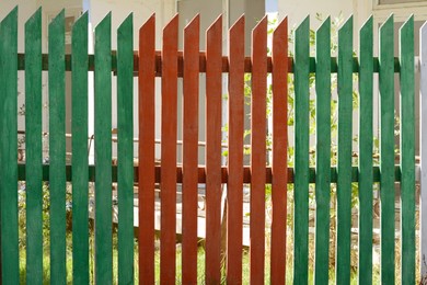 Photo of Wooden fence on sunny day outdoors, closeup