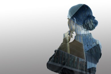 Image of Double exposure of businesswoman and office buildings