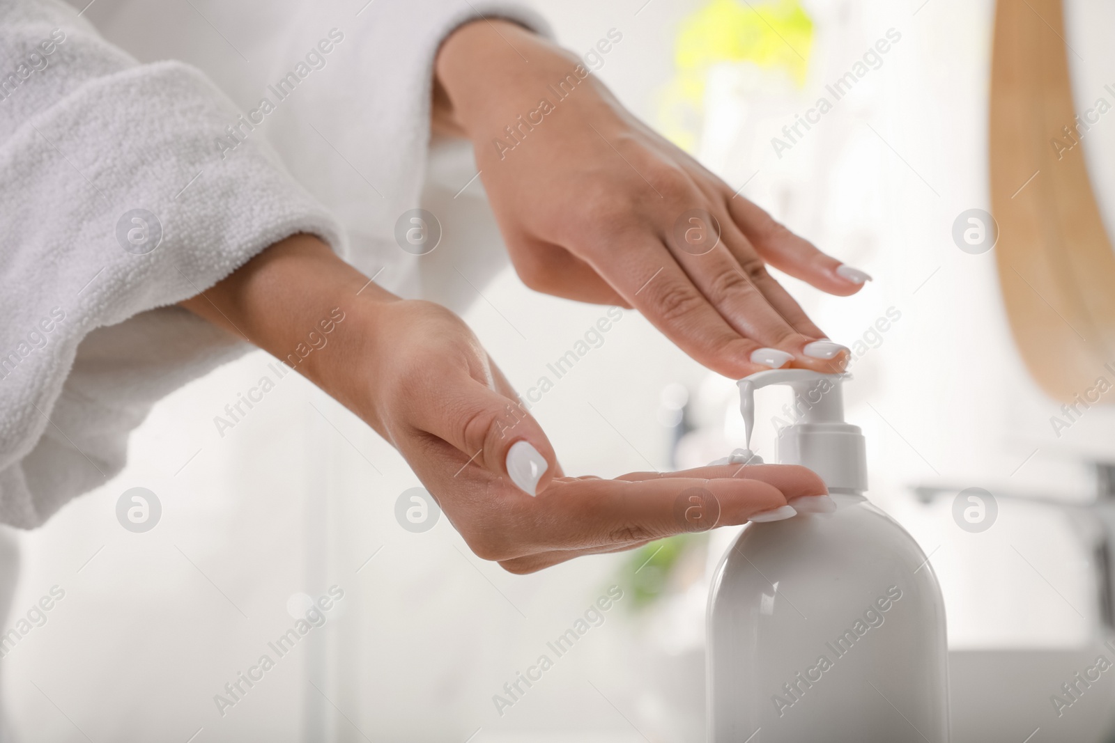 Photo of Teenage girl using gel in bathroom, closeup. Skin care cosmetic