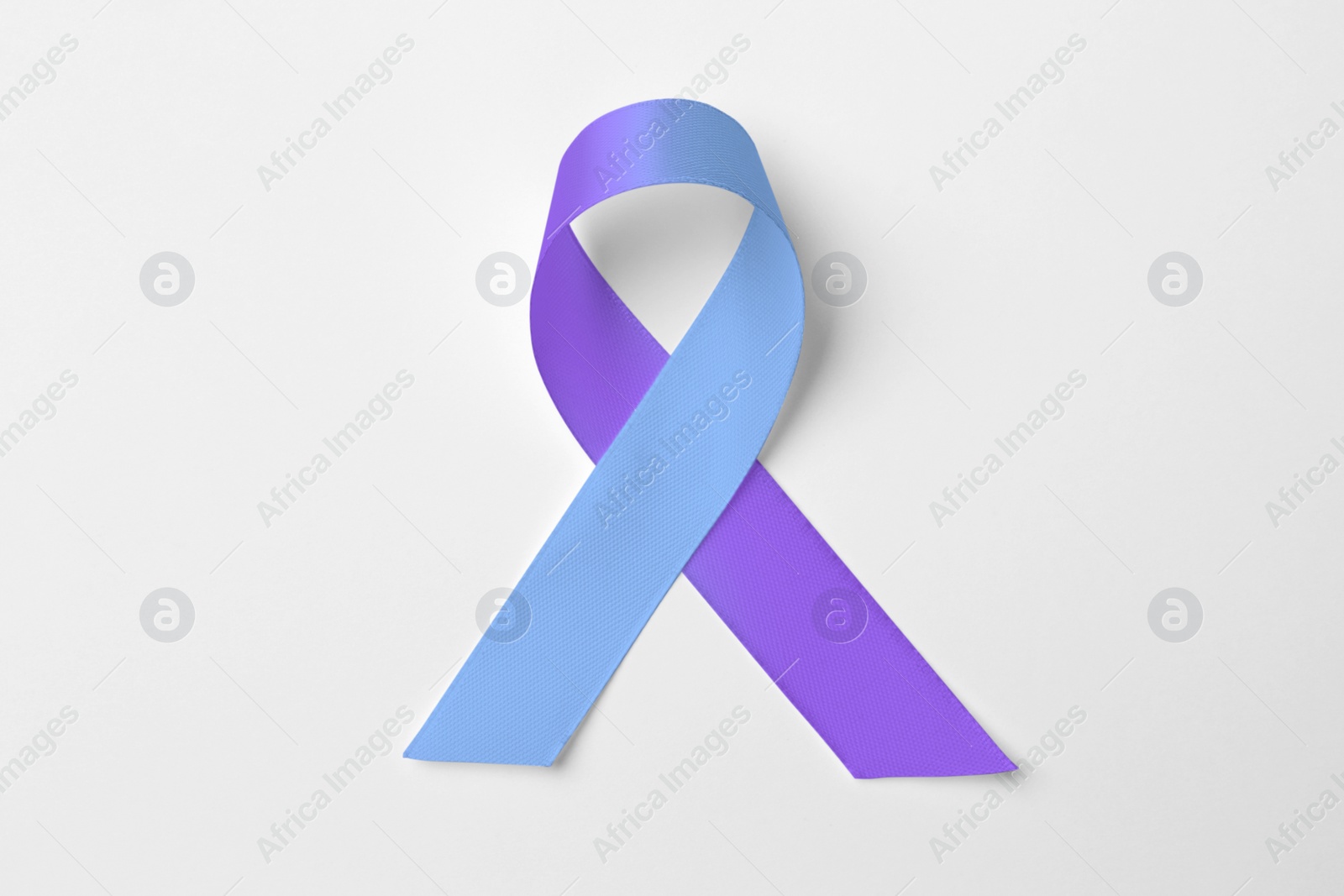 Image of World Arthritis Day. Blue and purple awareness ribbon on white background, top view