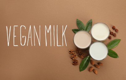 Image of Different vegan milks and nuts on brown background, flat lay