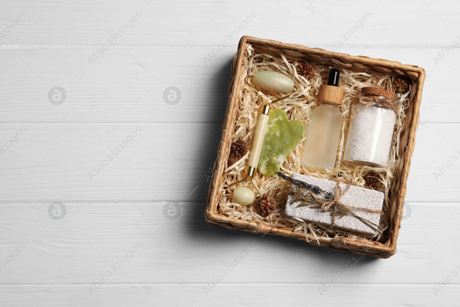 Photo of Spa gift set on white wooden table, top view. Space for text