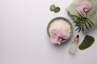 Flat lay composition with different spa products on white background. Space for text