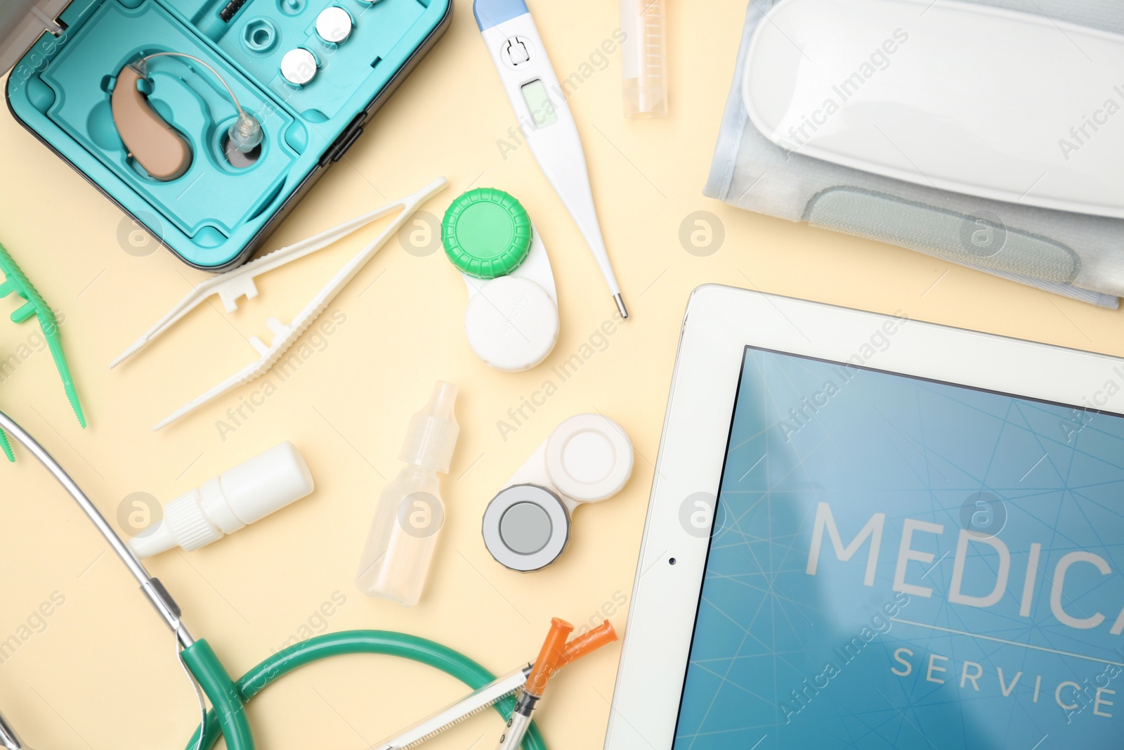 Photo of Flat lay composition with medical objects on color background