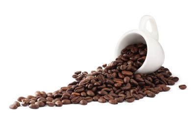 Photo of Coffee beans and overturned cup isolated on white