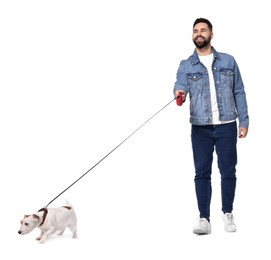 Smiling man walking with dog on white background