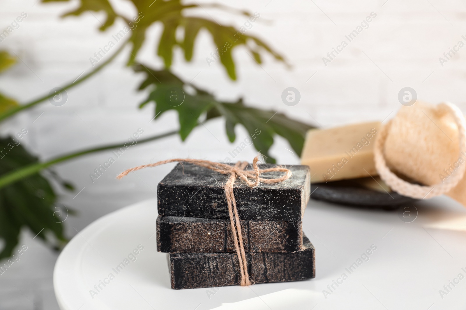 Photo of Stack of handmade soap bars on table