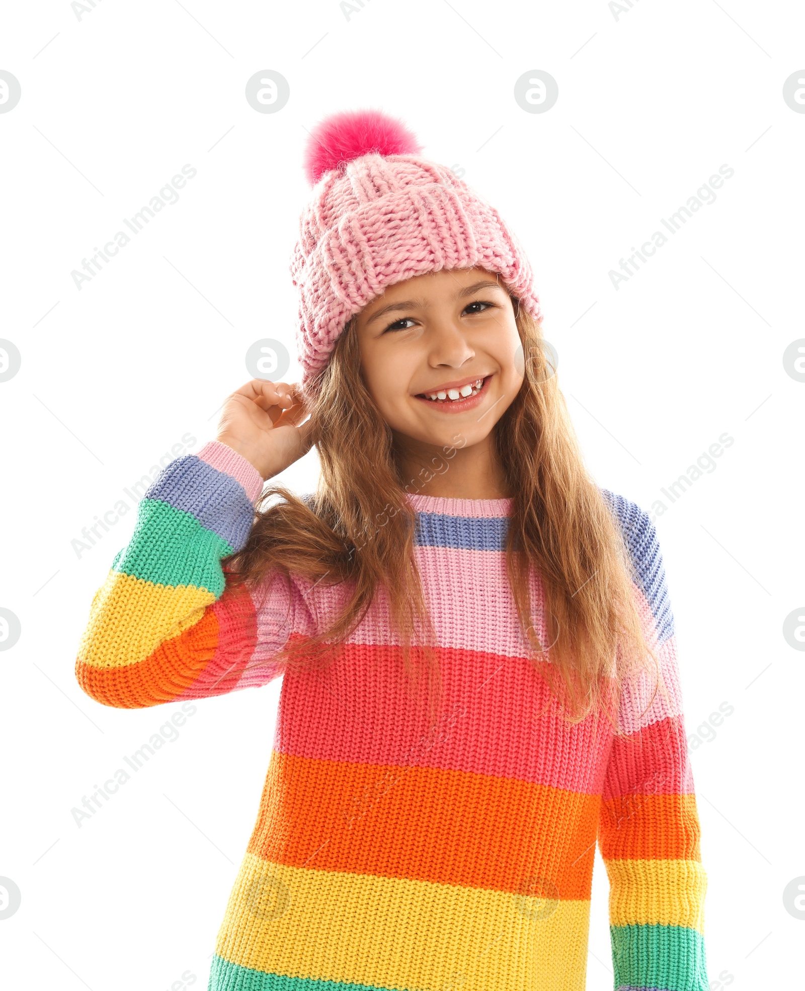 Photo of Cute little girl in warm clothes on white background. Winter vacation